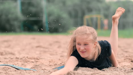 Slow-motion:-a-Young-woman-jumping-in-the-fall-hits-the-ball-on-the-sand.-Volleyball-player-makes-a-team-and-plays-the-ball-off-in-the-fall.